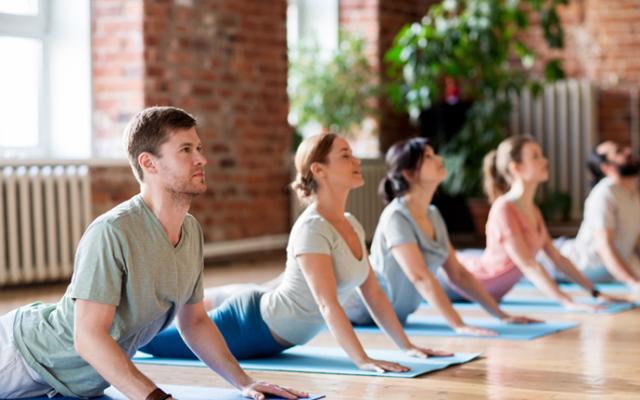 Group of people practising yoga